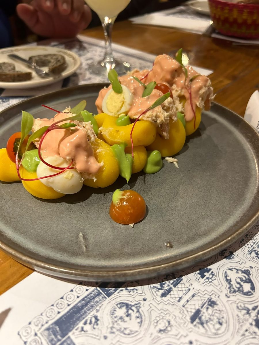 Causa limeña plated with seafood