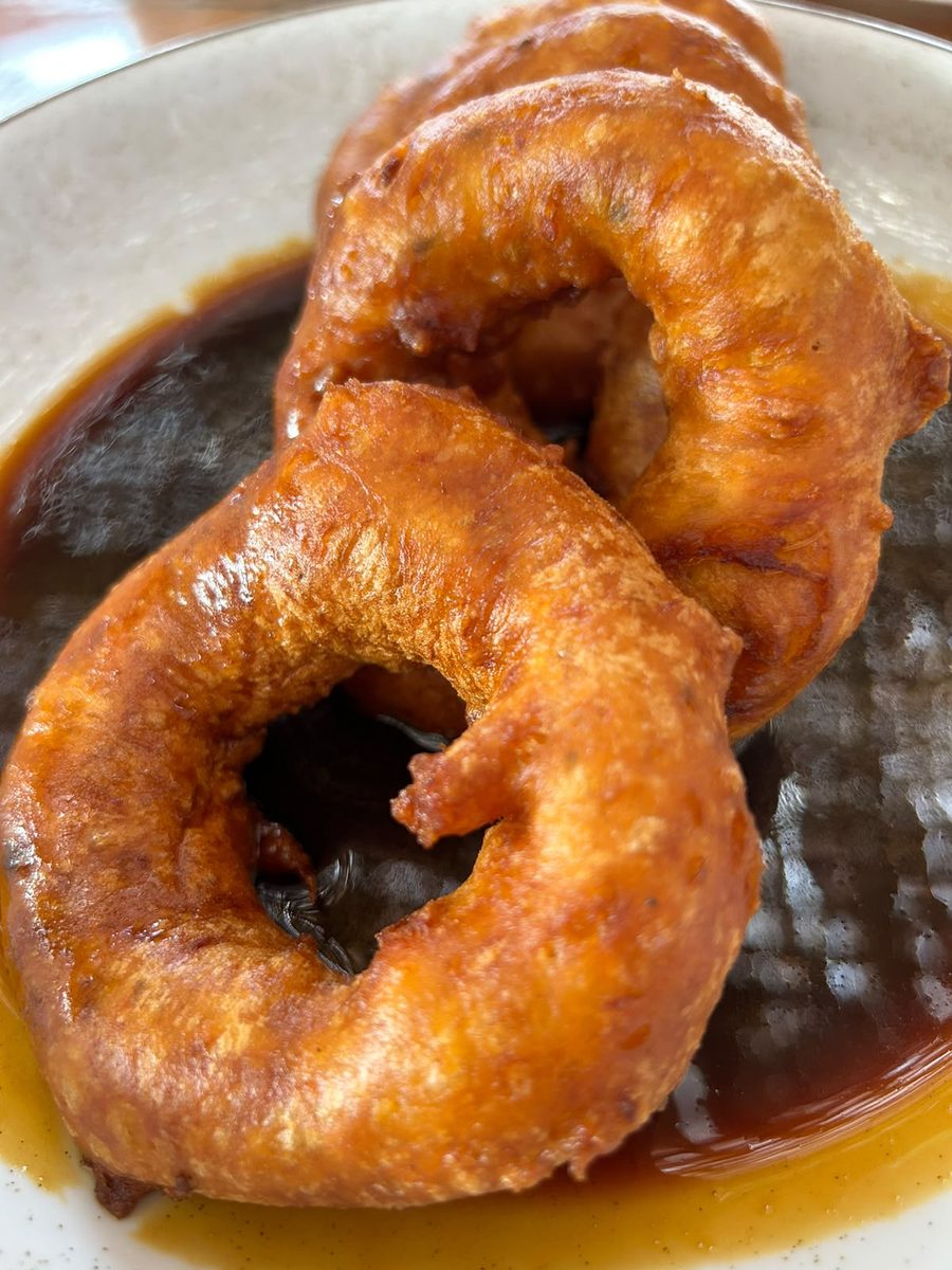 Golden picarones in cane syrup