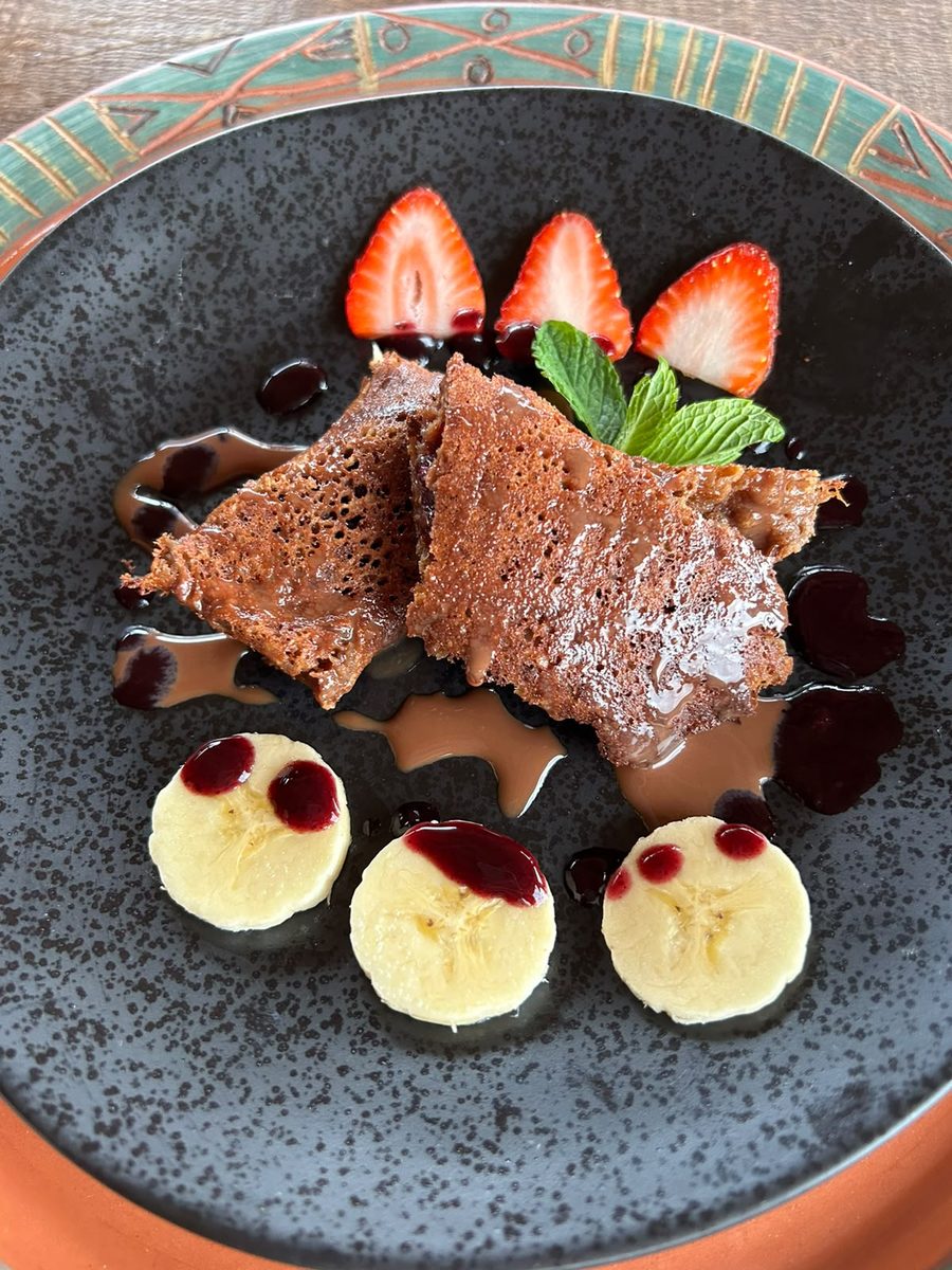 Dessert with strawberries, banana and chocolate sauce